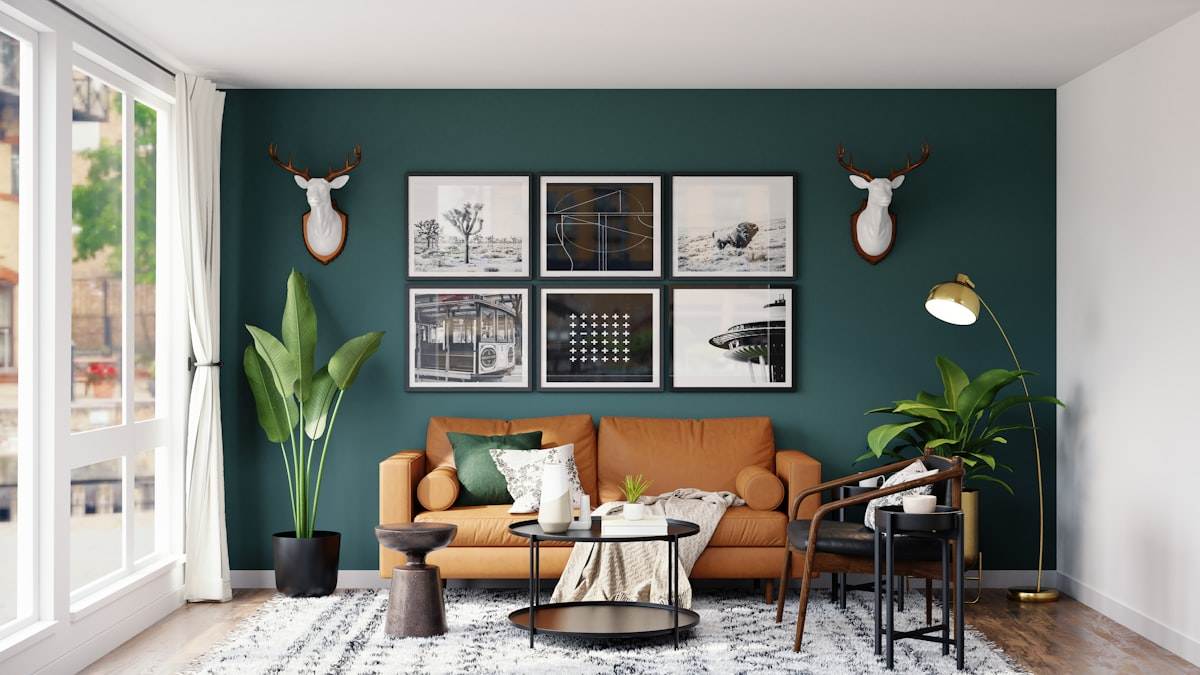 The finished warm interior — leather, timber, and gallery wall